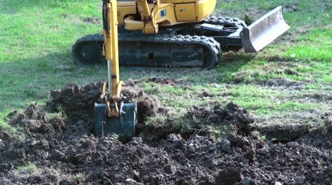 Excavator reversing the earth Stock Footage 67939832