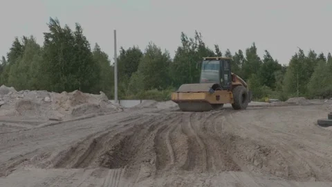 Excavator rides on a construction site Stock Footage 132495172