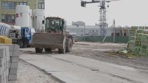 Excavator rides on a construction site Stock Footage 132495201