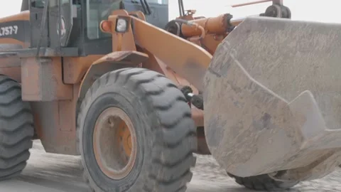 Excavator rides on a construction site Stock Footage 132495218