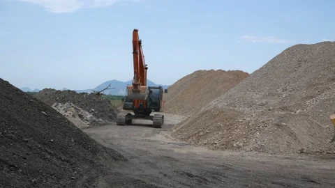 Excavator rides through construction site. Russia, Stavropol, 10.06.20 Stock Footage 144244081
