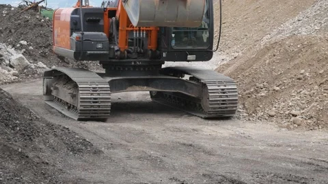 Excavator rides through construction site. Russia, Stavropol, 10.06.20 Video stock 144244115