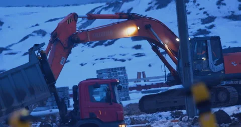 Excavator with a ripper tooth performs overburden works, softening a frozen soil Stock Footage 147630171