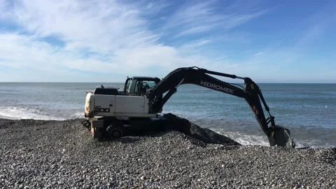 Excavator on the seashore Stock Footage 231323047