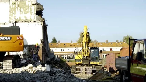 Excavator segregates debris - 4K Video stock 69176857