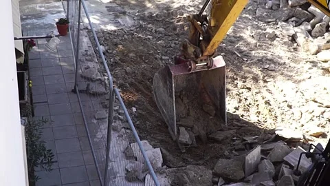 Excavator shift some slabs Stock Footage 188459428