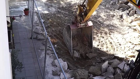 Excavator shift some slabs, slow motion Stock Footage 190590013
