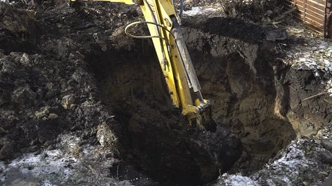 Excavator shovel digging a deep hole Stock Footage 94459650