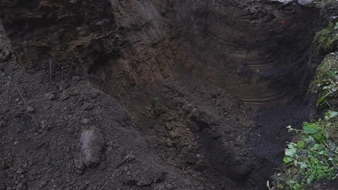 Excavator shovel digging a deep hole Stock Footage 94461379