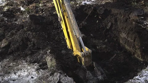 Excavator shovel digs into a ground 스톡 동영상 94488415
