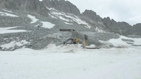 An excavator on a snow mountain Stock Footage 194839460