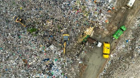 Excavator Sorting Municipal Solid Waste At A Large Landfill Site In Thailan.. Stock Photos