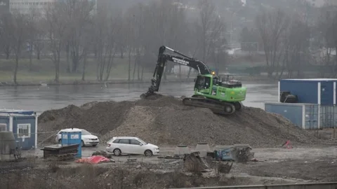 Excavator standing on heap of soil digging Stock Footage 148320878