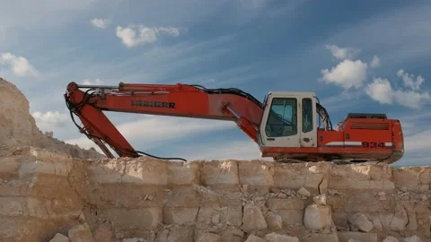 Excavator stands on the background of a stone quarry. Stock Footage 158387146