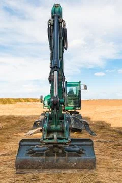 Excavator on the territory of beginning construction Stock Photos