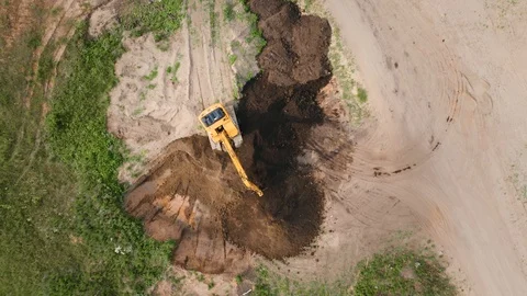 Excavator tractor digger working, aerial top down view Stock Footage 112043207