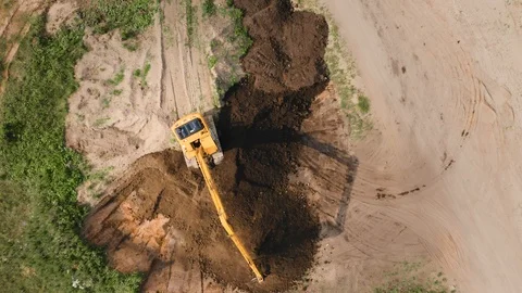 Excavator tractor digger working, aerial top down view Stock-Footage 112043216