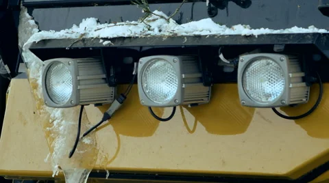 Excavator turning lights on in the dark Stock Footage 64551480