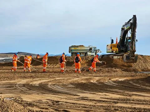 Excavator type construction machinery working on bulk earthworks  in a mine. Stock Photos