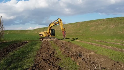 Excavator uprooting trees Stock Footage 125838791