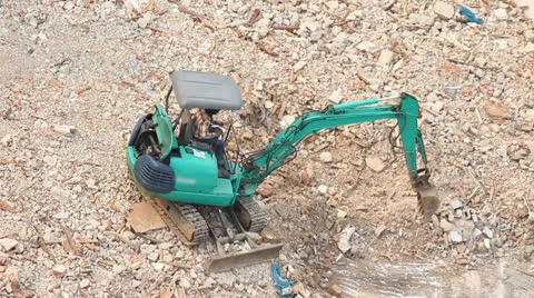 Excavator was working on the stone Stockbeeldmateriaal 22979654