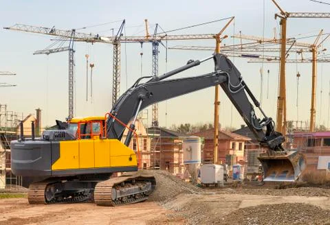 Excavator at work in construction site Stock Photos