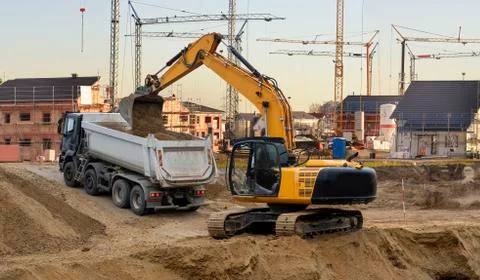 Excavator at work in construction site Stock Photos