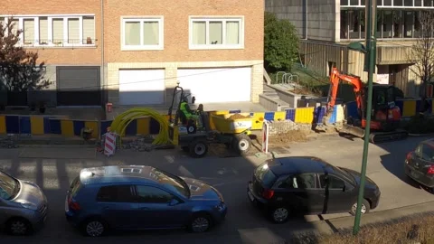 Excavator at work digging ground to lay cables - Time lapse Stock Footage 237917423
