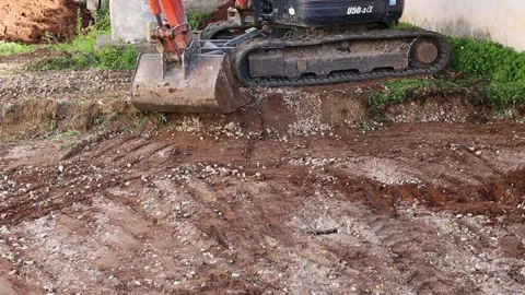 Excavator at work digs the foundations for a construction 스톡 동영상 168611951