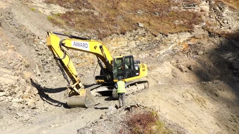 Excavator work in the mountains Stock Footage 153070159