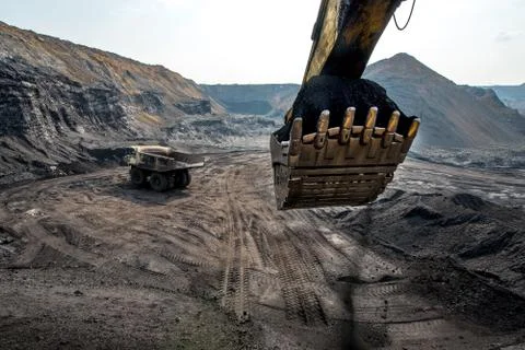 Excavator at work in open pit Stock Photos