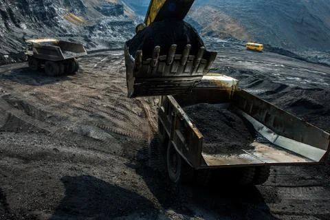 Excavator at work in open pit Stock Photos