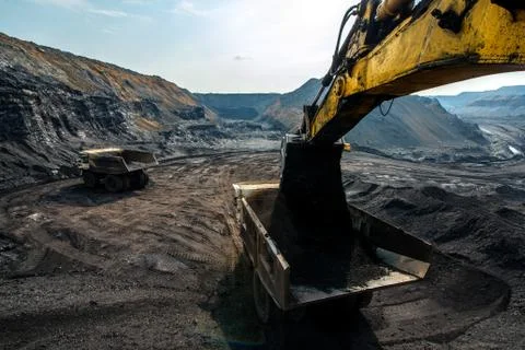 Excavator at work in open pit Stock Photos