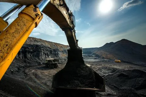 Excavator at work in open pit Stock Photos