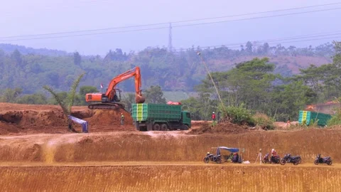 Excavator on Work, Ploughing Soil in the Construction Site Stock-Footage 132315879