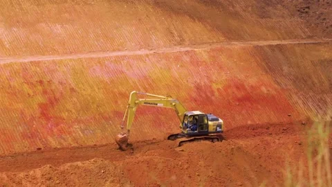 Excavator on Work, Ploughing Soil in the Construction Site Stock-Footage 132317418