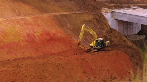 Excavator on Work, Ploughing Soil in the Construction Site Stock-Footage 132319008