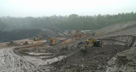 Excavator at work in a quarry, transporting soil, Germany Stock Footage 95743297