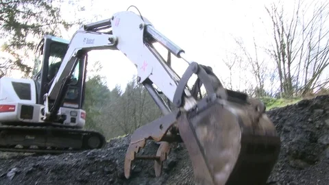 Excavator working and digging into shale rock Video stock 75276774