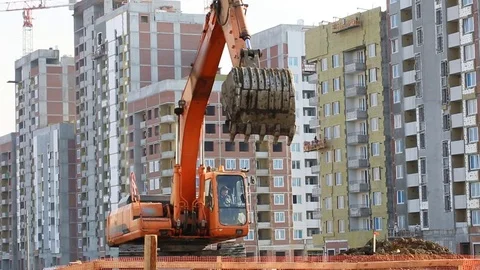 Excavator working at building site Stockbeeldmateriaal 81329896