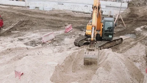 Excavator working on construction site 스톡 동영상 69779759