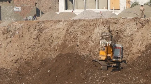 Excavator working at a construction site Stock Footage 86653541