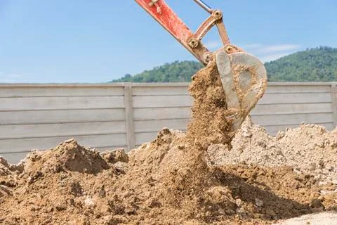 Excavator working at construction site Stock Photos