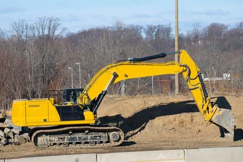 Excavator working at construction site Stock Photos