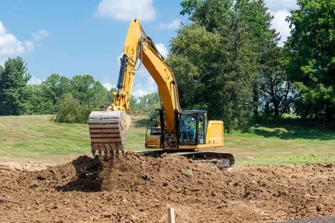 Excavator working on a construction site Stock Photos