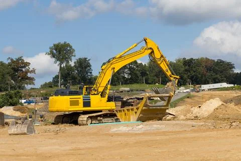 Excavator working on a construction site Stock Photos