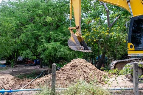 Excavator Working at Construction Site Stock Photos