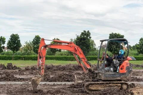 Excavator Working on Construction Site Stock Photos