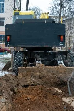 The excavator is working on the construction site to replace the pipeline in  스톡 사진