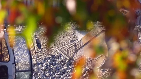 Excavator working on construction site zoomout Stock Footage 72994977